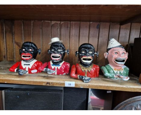 A group of four mechanical money banks. Note:- These items are listed on the basis they are illustrative of a bygone culture 