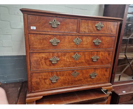 A George III "red walnut" mahogany chest of drawers, width 101cm, depth 56cm & height 90cm. Condition- later bracket feet, la
