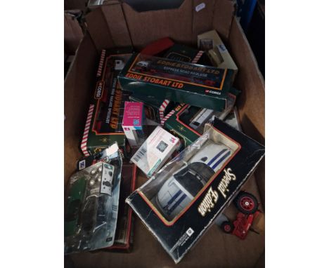 A box of die cast model vehicles including boxed Eddie Stobart, lorries, cars, etc.