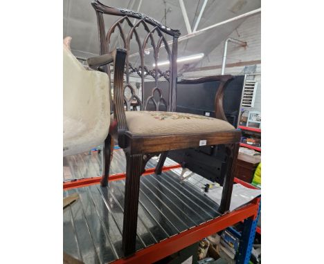A Chippendale style mahogany armchair with tapestry seat and Gothic arches to the back. 