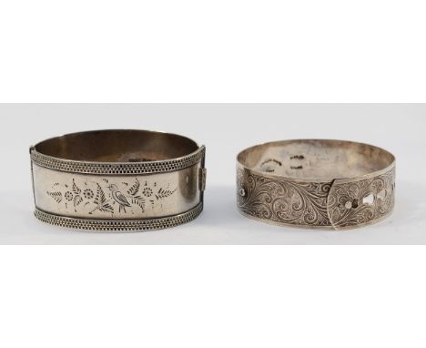 A 925 silver hinged bangle, engraved with bird details, Birmingham 1935, together with a silver buckle bangle with engraved d