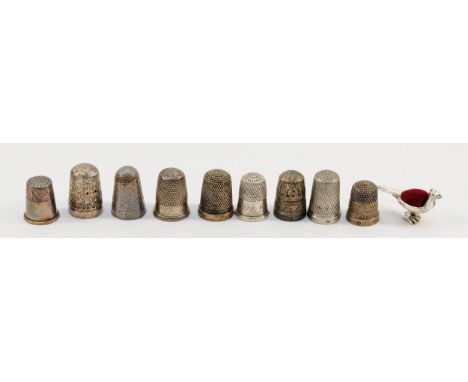 A silver thimble, Chester 1902, together with six other silver thimbles, two 925 silver thimbles and a silver pincushion in t