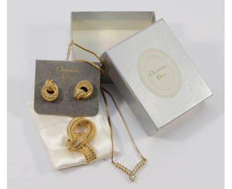 Christian Dior, a gilt metal gemset brooch, 45mm, with a pair of matching earrings, 20mm, and a Christian Dior, gilt metal ge
