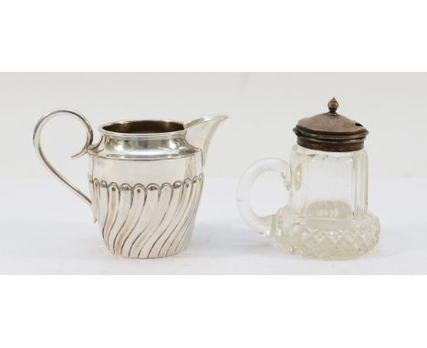 A Victorian silver embossed cream jug, Birmingham 1891, 6cm, 52gm, together with a glass and sterling silver lidded mustard j