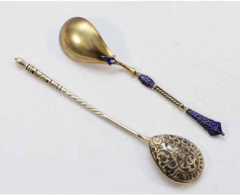 A Russian silver and niello lemon tea spoon, together with a Scandinavian 930 standard silver and enamel spoon, 41gm.