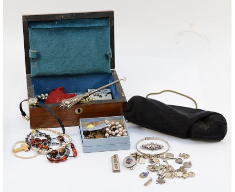Two silver ingots, a 925 silver and enamel charm bracelet, three silver brooches, a silver bangle, total silver weight 95g, w