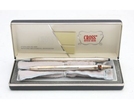 Cross, a sterling silver biro and propelling pencil set, pouches, case, booklet, apparently unused.