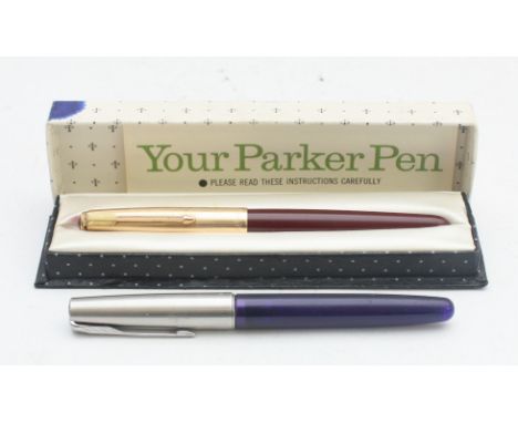 Parker 51, red barrel fountain pen, case and booklet and a Parker Frontier blue barrel fountain pen (2)