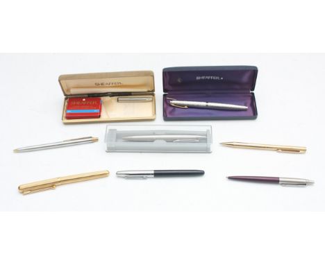 Sheaffer, a silver plated fountain pen with 14K gold nib, a Parker biro and other pens,