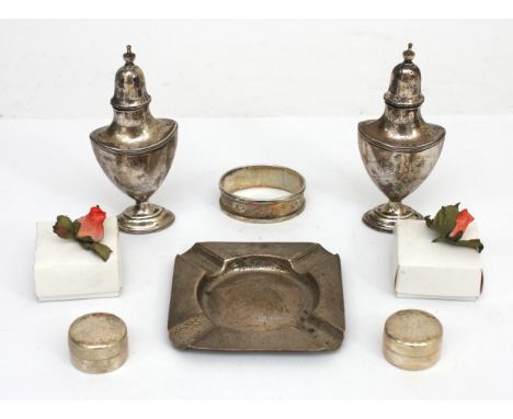 A matching silver salt and pepper pot, Sheffield 1907, one loaded, together with a silver napkin ring, Birmingham 1950, two 9