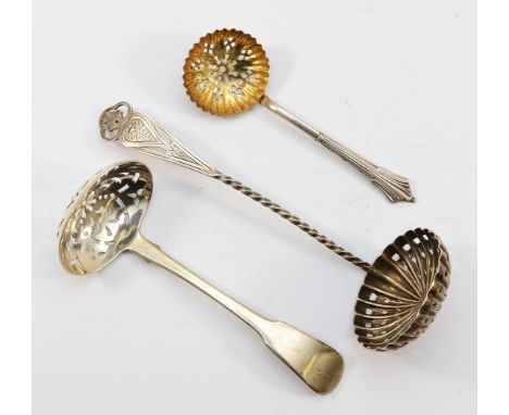 A silver sugar sifter ladle, Sheffield 1896, together with two other sifters, London 1896, 1818, 77gm.