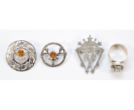 A 925 silver Luckenbooth brooch, 45mm, a Caithness glass 925 silver ring, T, an d two sterling silver gemset stag brooches, 2