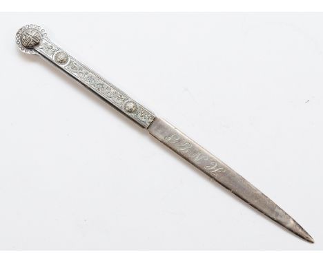 A silver letter opener, Sheffield 1997, with H.N.G.S engraved to the blade, having Celtic pattern to the handle, 64gm, 22cm.