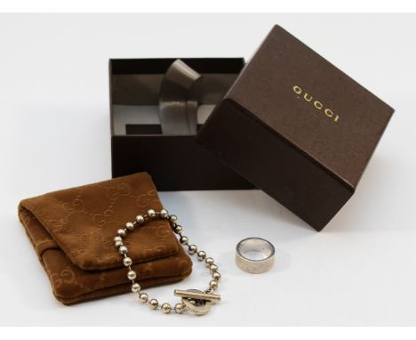 Gucci, a 925 silver beaded bracelet, 19.5cm, with a Gucci 925 silver ring, M, 25g