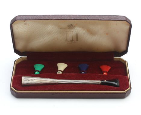 Dunhill, a silver cigarette holder, by Alfred Dunhill, Birmingham 1960, sprung loaded with five mouth pieces, case