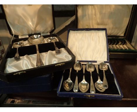 Shelf of boxed silver plate cutlery