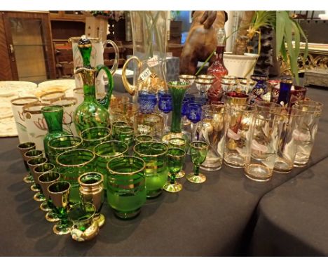 Large amount of Bohemian crystal glass mainly highly decorated blue and gold some with applied ceramic flowers 