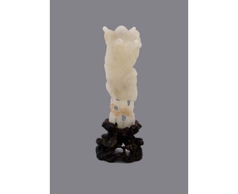 A Chinese white or pale green jade 'Finger citrus' carving, late 18th or 19th century, modelled as a finger citrus issuing fr