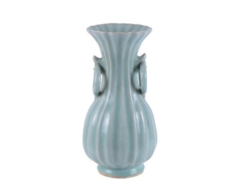 A Chinese Longquan celadon lobed vase, the petal-lobed sides rising elegantly to the flaring trumpet neck with bracket-lobed 