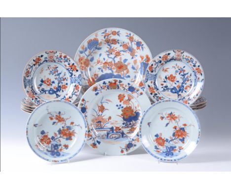 A set of nine Chinese Imari plates, Kangxi (1662-1722), painted within the central medallion with garden scene and birds perc