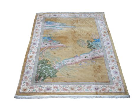 A large Chinese carpet, approximately 549cm x 360cm黄地山水台阁图大毯