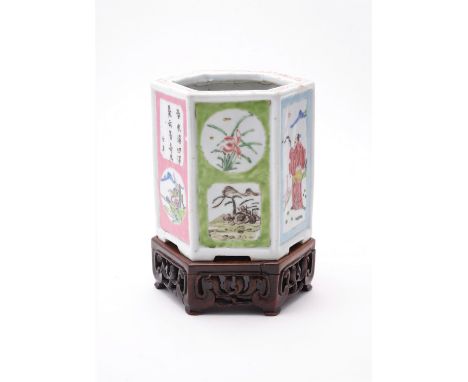 A Chinese hexagonal 'Famille Rose' brush pot, Qing Dynasty, Yongzheng, painted with alternating panels of landscapes, poems a
