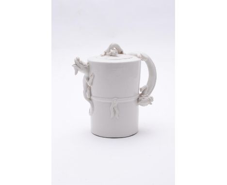 A Chinese blanc-de-chine wine pot and cover, Kangxi period (1654-1722), Qing dynasty, the body of cylindrical form, slightly 