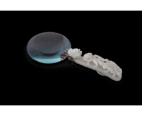 A Chinese pale celadon jade belt hook adapted as a magnifying glass, the jade 18th century, the  dragon-head hook mounted wit