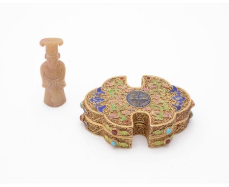 A Chinese gilt filigree box and a jade figure, the box centring with a shou medallion flanked with polychrome foliage and bat
