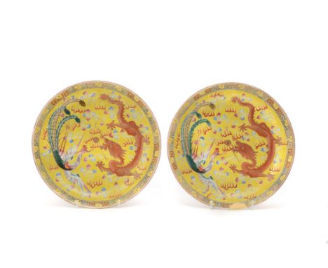A pair of Chinese 'Dragon and Phoenix' dishes, Guangxu, enclosing a five-clawed dragon and a long-tailed phoenix, reserved on