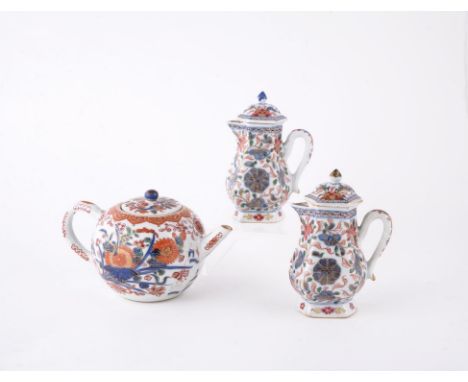 A pair of Chinese hexagonal 'Imari' cream jugs and covers, Qianlong, painted in underglaze blue and iron-red with pink and ye