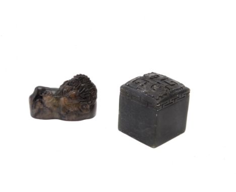 Two Chinese soapstone seals, one dedicately carved in the round with a dragon chasing a flaming pearl amidst clouds, the seal