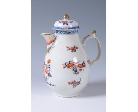 A Chinese Imari coffee pot and cover, Kangxi (1662-1722), decorated with flowering foliage in underglaze blue and finely pain