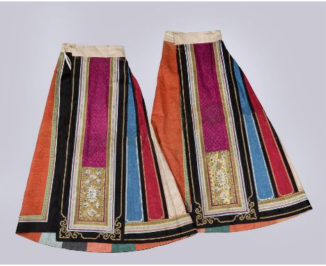 A Chinese wedding skirt, Qing Dynasty, 19th century, with multi coloured panels in two parts, patterned damask silk embellish