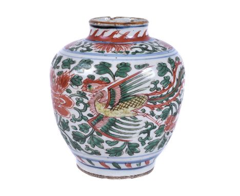 A Chinese wucai 'Phoenix' jar, Ming Dynasty, 17th century, decorated with two phoenixes in flight amidst peony scroll, 18.3cm