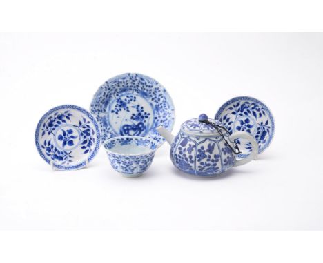 A Chinese blue and white 'Shipwreck' tea pot and cover, Kangxi, painted with panels of rabbits, flowers and birds, 9cm high a