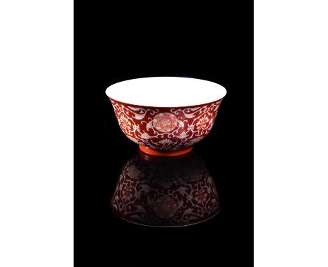A Chinese coral-ground reserve decorated 'Lotus' bowl, seal mark and period of Qianlong (1735-1796), with deep rounded sides 