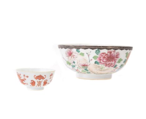 A Chinese Export 'Famille Rose' bowl, Qianlong, the exterior painted with peony, the rim with silver mount inscribed 'Gift of