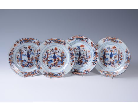 A set of four Chinese Imari plates, Kangxi (1662-1722), decorated with one vase positioned on a scroll with a landscaped scen