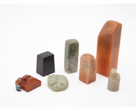 A group of six seals and one pendant, comprising a celadon uncarved jade seal, 4.7cm high, one jade circular pendant, 4.5cm l