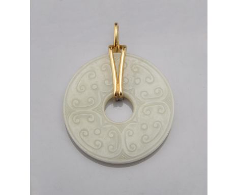 A Chinese white jade disc, bi, Qing Dynasty, 18th or 19th century, one side with four panels of 'C' scrolls, the other side w