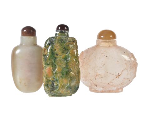 A mottled jade snuff bottle and stopper, unadorned, 6.8cm high; a carved hardstone 'Crane and Pine Tree' snuff bottle and sto