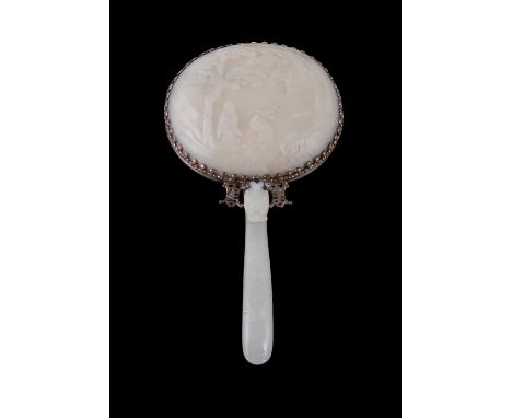 A Chinese white jade and metal mirror, the jade 18th century with later white metal mounts, the back of the mirror formed by 