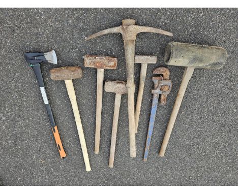 A collection of lump hammers and other tools 