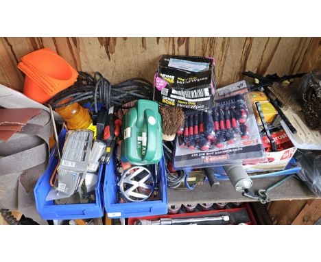 A shelf of tools, many unused. 