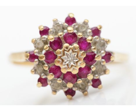 A 9ct gold diamond and ruby cluster ring, P, 2.2gm. 