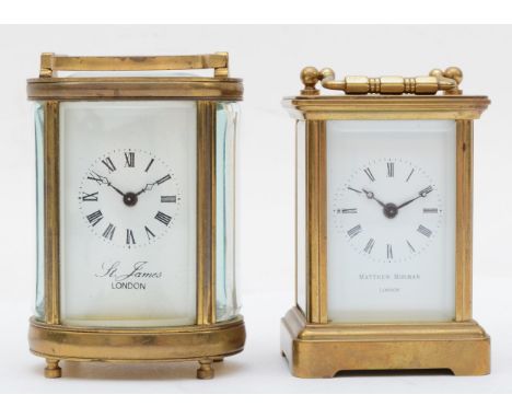 An oval brass cased carriage clock, 8cm, together with another carriage clock. 