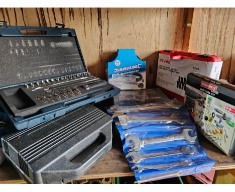 A collection of cased unused tools, including King Dick spanners. 