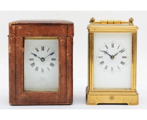 A brass cased 8 day carriage clock and a travel carriage clock. 