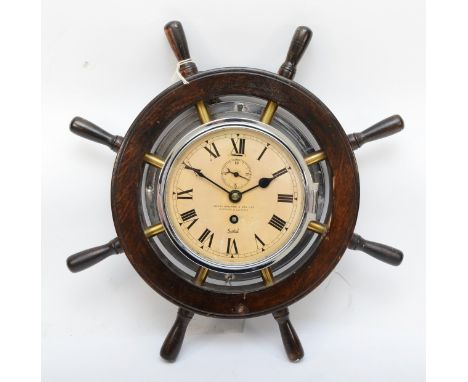 A ships wheel 8 day wall clock, 36cm. 